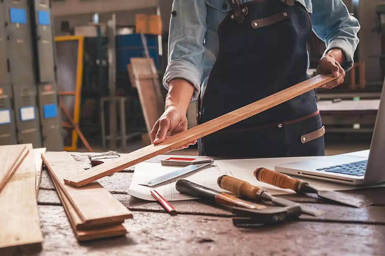 man holding the wooden piece hvac contractors in dubai