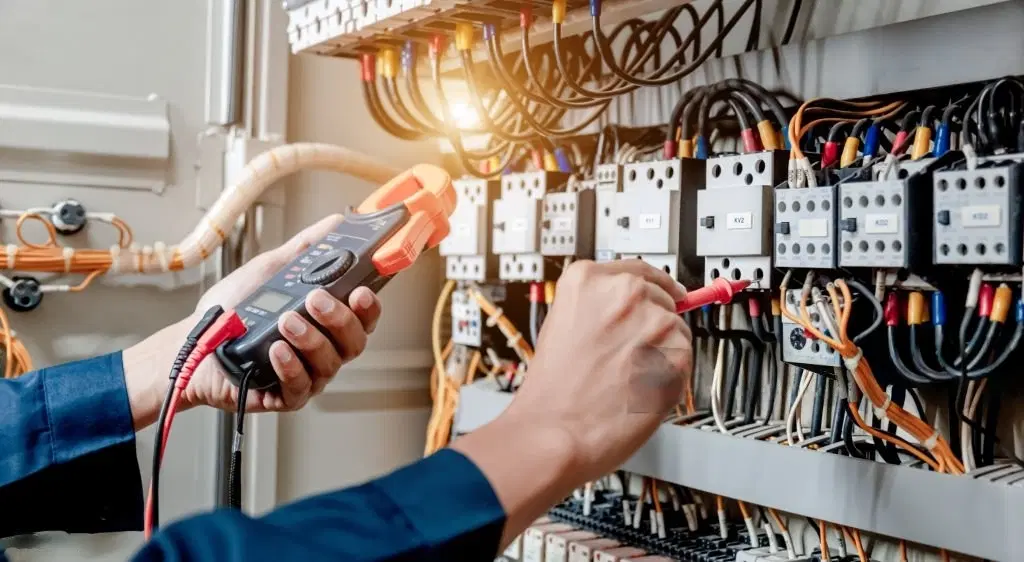 men repairing electrical cable check using machine