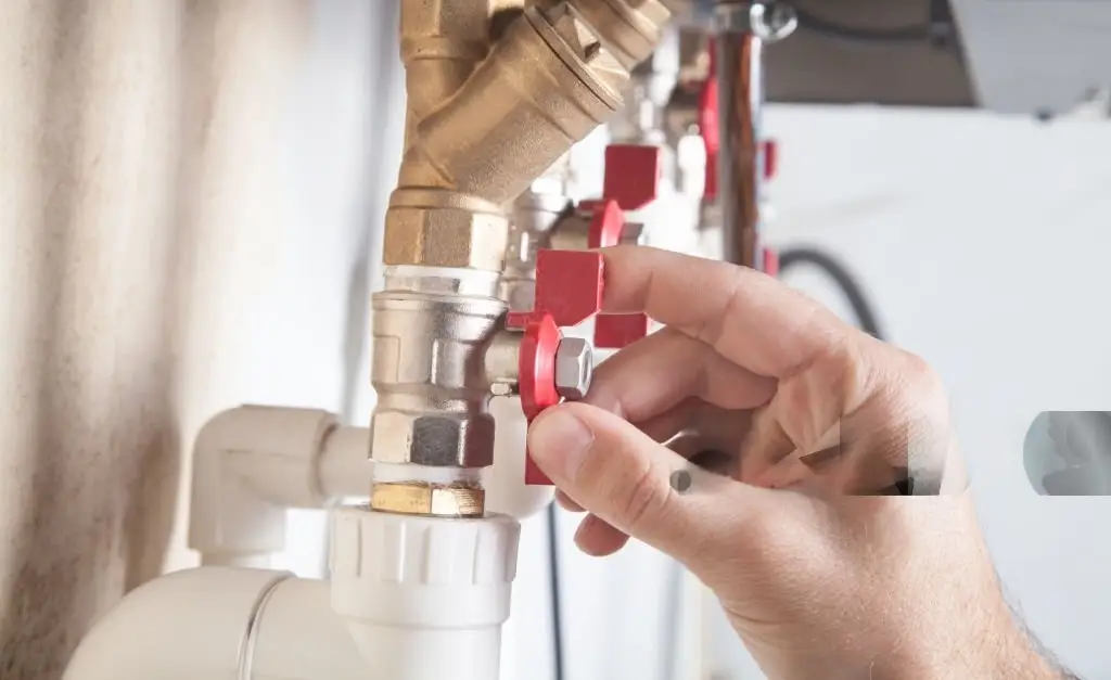 A man repairing pipe for hvac contractors work in dubai